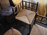 two chairs and a table in the corner of a room
