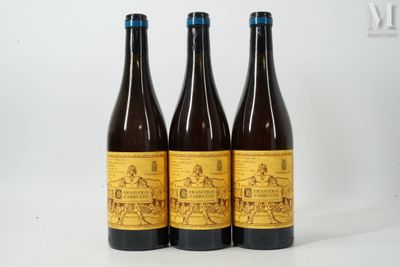 three bottles of beer sitting next to each other on a table