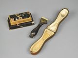 a small brush and a box on a table