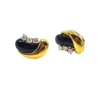 pair of black and gold earrings with diamonds on a white background