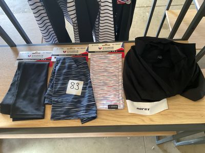 a table with a lot of clothing on top of it