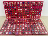 a lot of buttons in a red box on a table