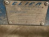 an image of a close up of a blue machine on a floor