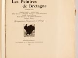 un livre ouvert sur lequel figure l'image d'une vache