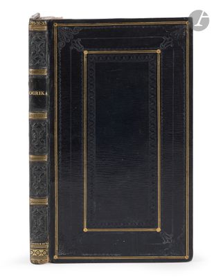a black book with gold trim and a gold border