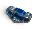 a close up of a blue ring on a white surface