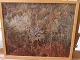 a picture of a painting on a easel in a room