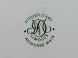 a close up of a plate with a black and white design on it