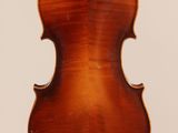 an antique violin with a wooden back and a long neck