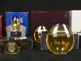 a lot of perfume bottles that are sitting on a table