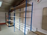 a room with shelves and shelves in it that are being built