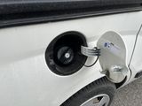 an electric car plugged in to a charging station