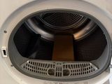 a washing machine that is sitting on the floor