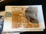 many old photos of people sitting on a table