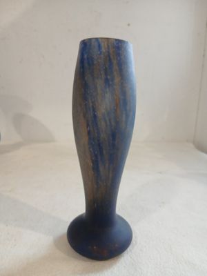 two vases that are sitting on a white surface
