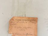 a piece of paper taped to a wall with writing on it