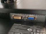 the back side of a computer with a couple of cables connected to it