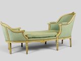 a chaise lounger with a green upholstered seat