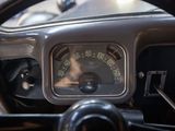 steering wheel of a car with a speedometer on the dashboard