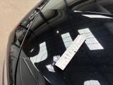 a parking ticket on the hood of a car