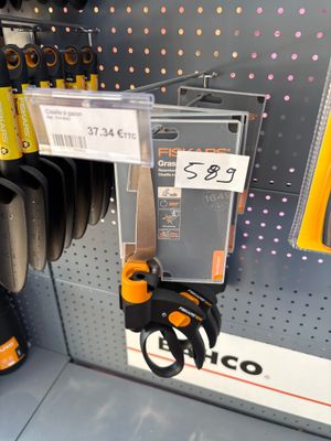 a picture of a pair of scissors hanging on a wall