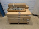 several boxes are stacked on top of each other in front of a wall