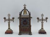 three different types of clocks on display on a table