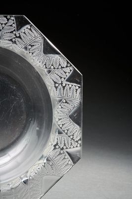 a glass plate with a design on it on a table
