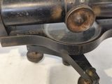 a close up of a gun on a white surface