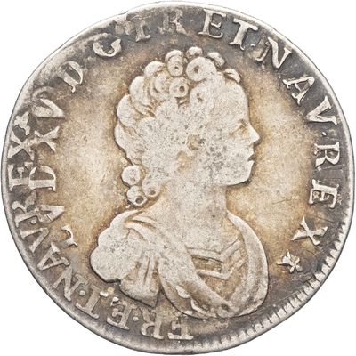 gros plan d'une pièce de monnaie sur laquelle figure un visage de femme