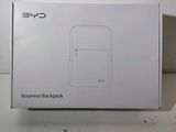 the box of a white backpack sitting on top of a table