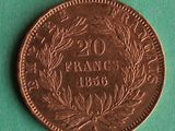 a close up of a coin on a table with a green background