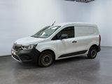 the white van is parked in a large room with a white wall