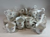 a lot of cups and saucers on the table