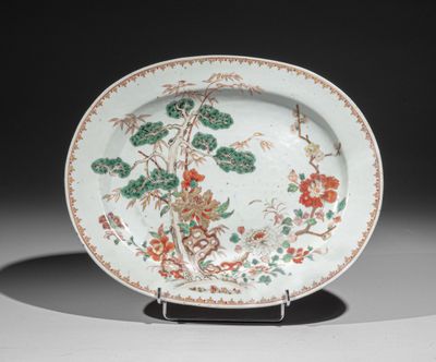 an image of a plate with flowers and birds painted on it