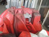 many bags of luggage sitting in a pile on the ground