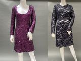 two mannequins dressed in purple and black dresses on display
