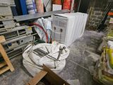 a room with a lot of electronics on the floor