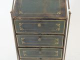 an image of a green and gold chest of drawers on a metal stand