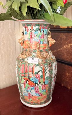 a vase with flowers in it sitting on a table