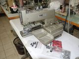 a sewing machine sitting on a table in a room
