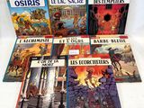 six children ' s books in french and english are on a white surface