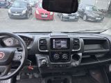 a dashboard view of a car with many cars in the background