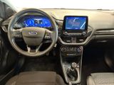 the interior of a car with a steering wheel, dashboard, and display screen
