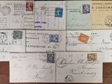 a lot of old postcards on a wooden table