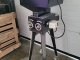 an image of a grill with a laptop on top of it