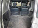 a white van with the door open and the back of the van is empty