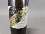 a bottle of wine that is sitting on a table