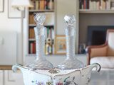 two vases sitting on a table in a living room