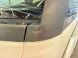 a close up of a bus with a broken window
